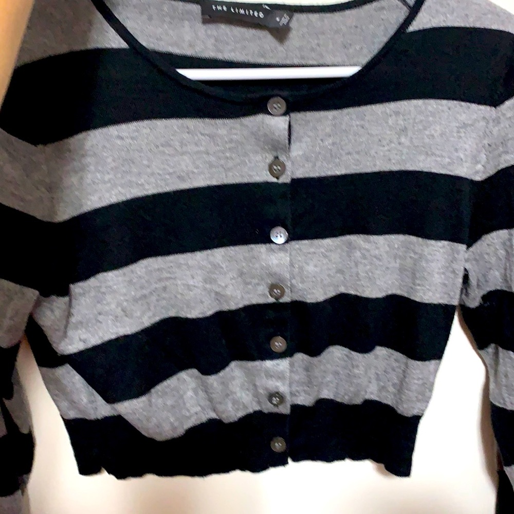 A black and grey sweater